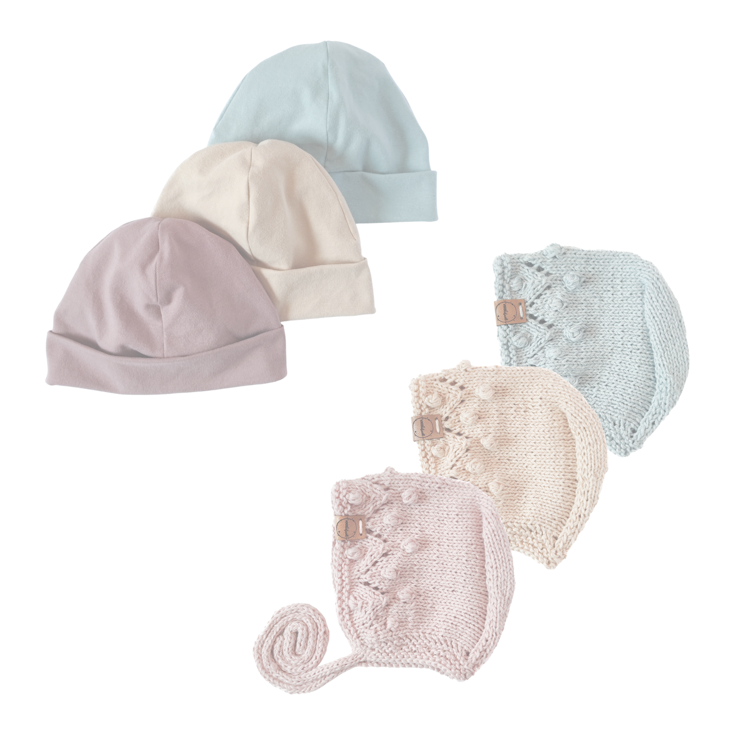 Baby-Mützen in rosa, beige und blau