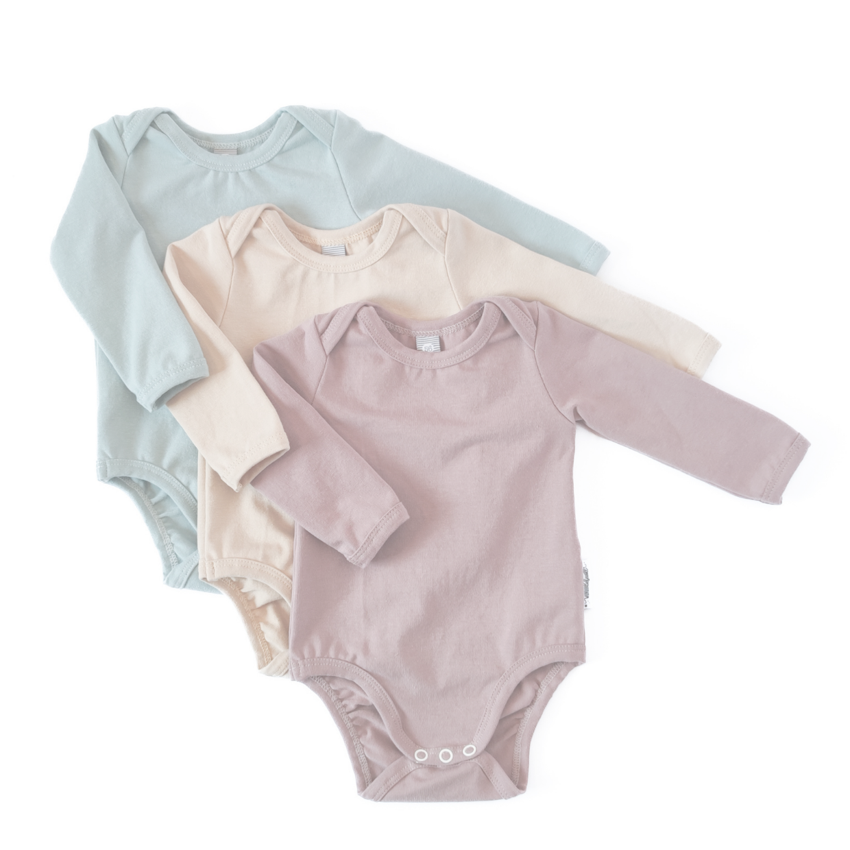 Bodys für Babys in rosa, beige und blau
